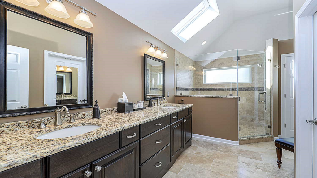 Experienced bathroom remodelers showcasing their craftsmanship in a newly remodeled space